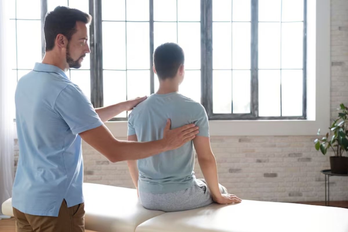 patient receiving massage therapy for back pain relief.