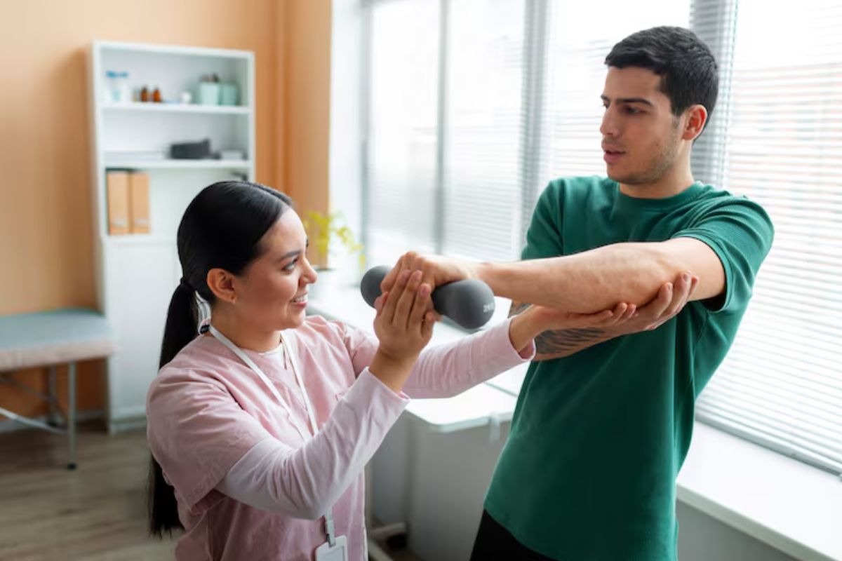 physiotherapist guiding a patient through an exercise for improved mobility.