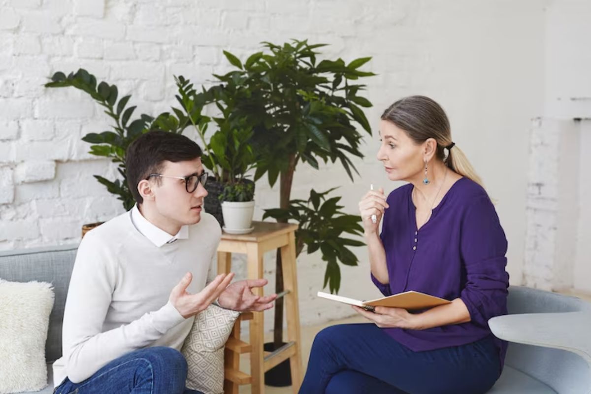 a person talking with a psychological counsellor during a counselling session.